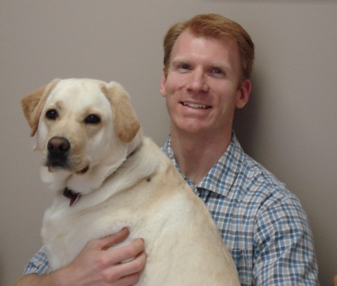 Dr. Derek and his yellow lab Misa